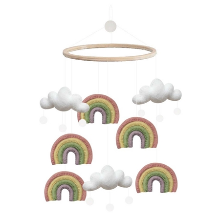 Karussell über der Krippe mit einem Regenbogen zwischen den Wolken