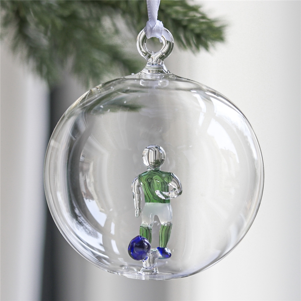 Transparente Glaskugel mit Fußballspieler