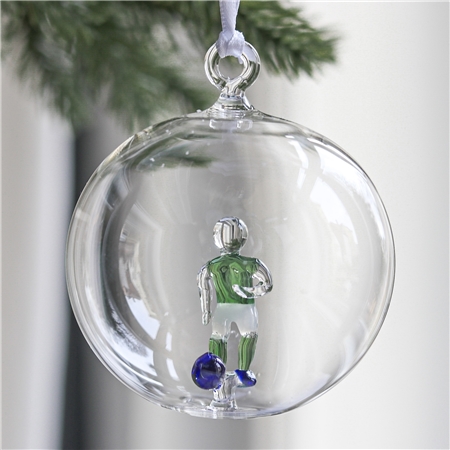 Transparente Glaskugel mit Fußballspieler
