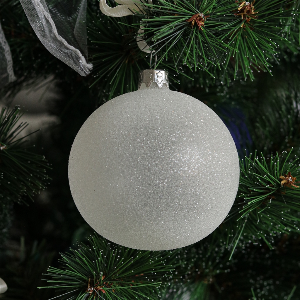 Glaskugel mit weißen Streuseln
