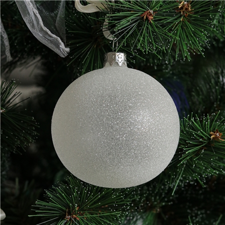 Glaskugel mit weißen Streuseln